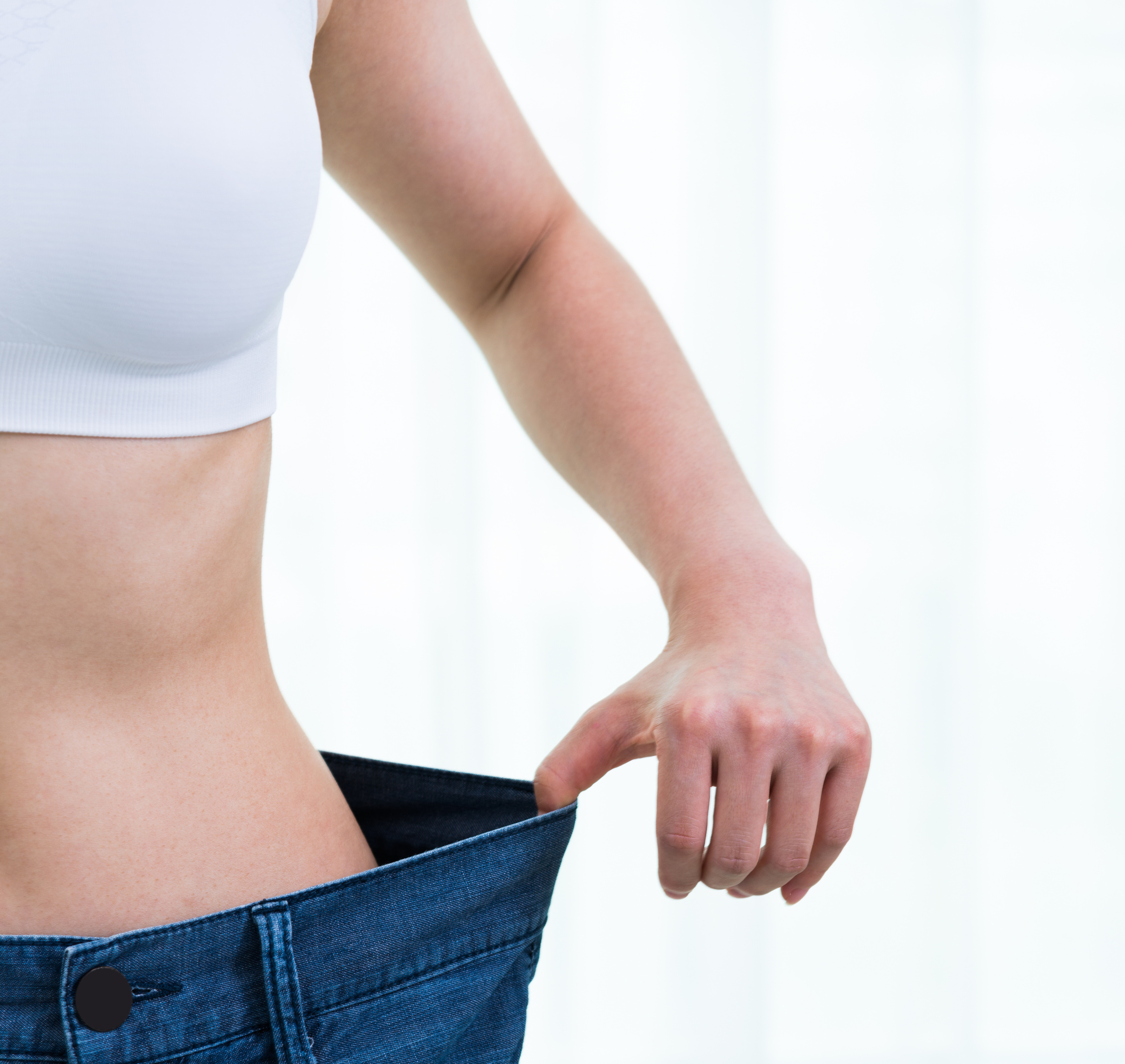 Young asian woman losing weight success